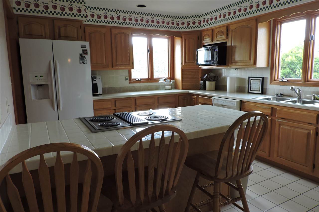 266 McKinley Road Middlebrook, VA 24459 - Photo 14 of 28 a kitchen with stainless steel appliances granite countertop a sink a stove a refrigerator a table and chairs