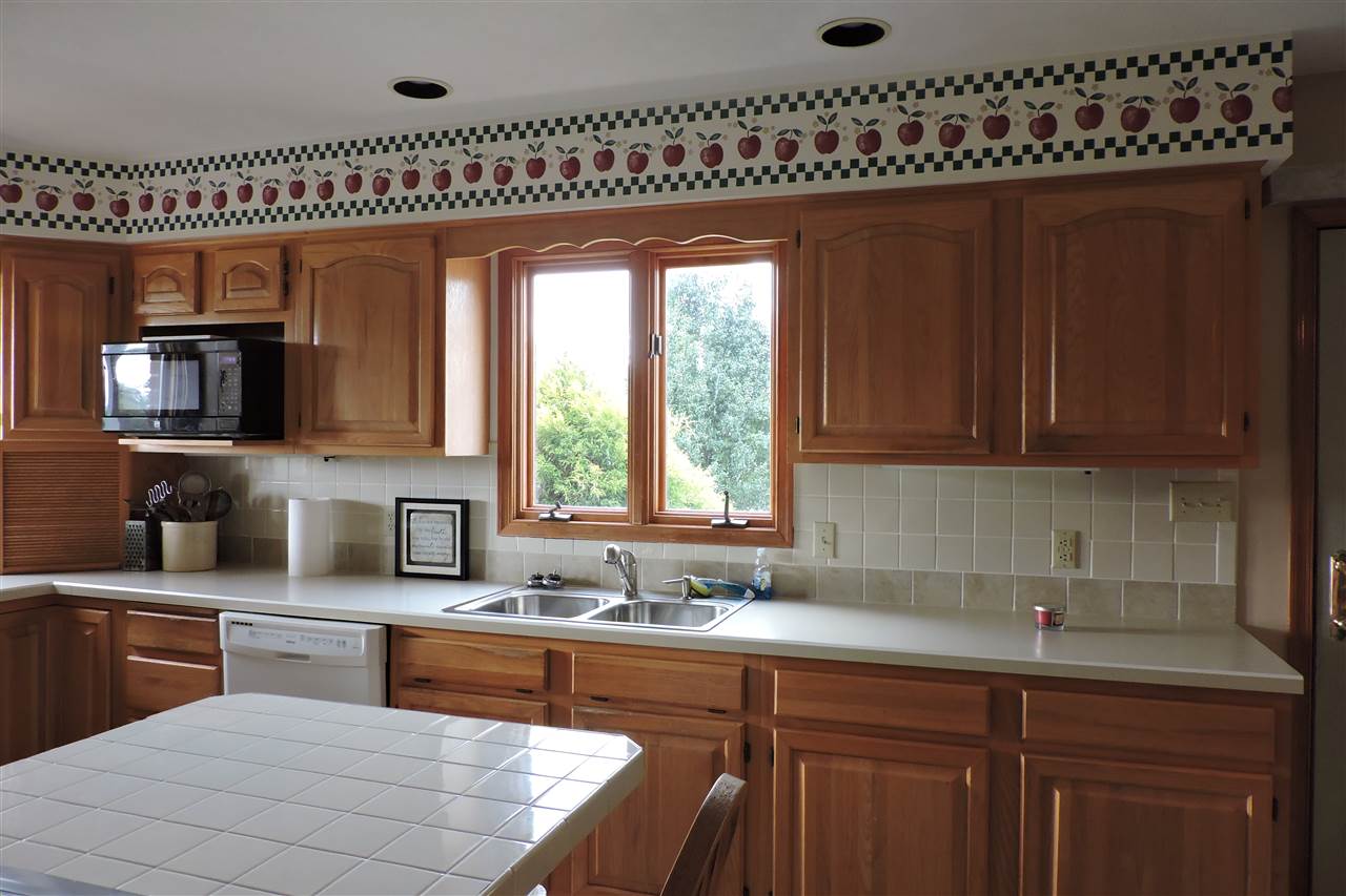 266 McKinley Road Middlebrook, VA 24459 - Photo 15 of 28 a kitchen with stainless steel appliances wooden cabinets a sink and a stove