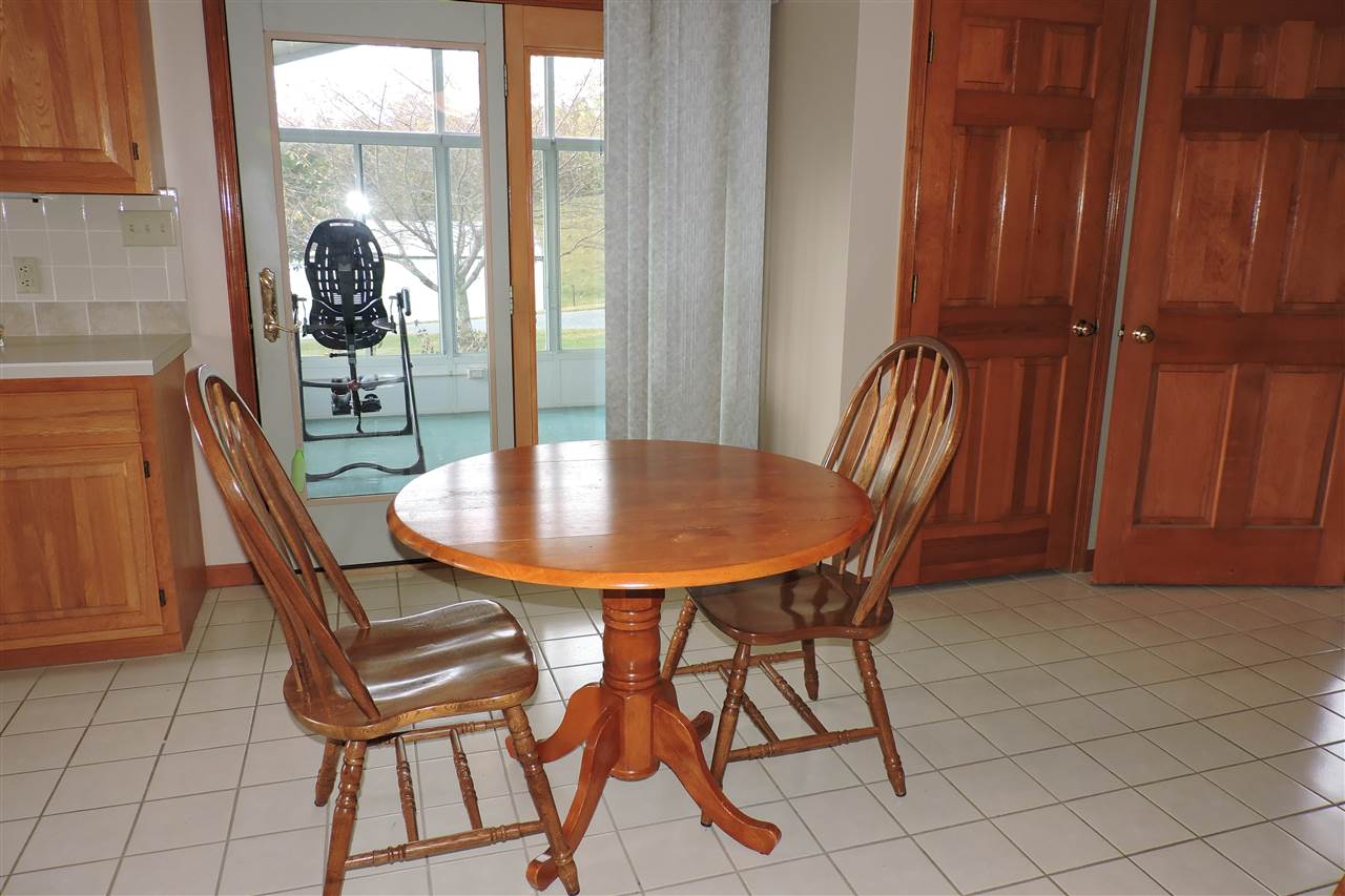 266 McKinley Road Middlebrook, VA 24459 - Photo 19 of 28 a view of a dining room with furniture and a window