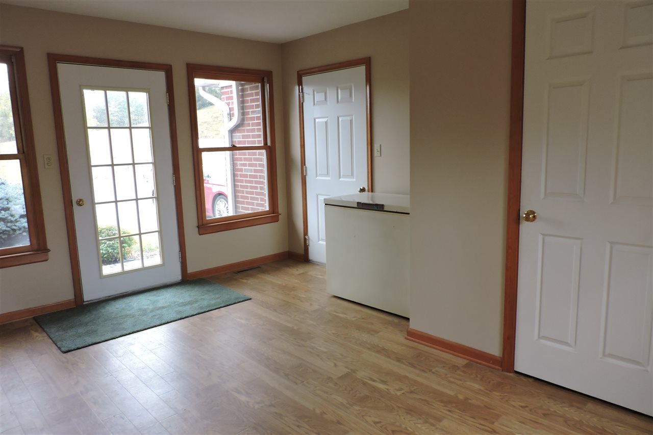 266 McKinley Road Middlebrook, VA 24459 - Photo 23 of 28 an empty room with wooden floor and windows