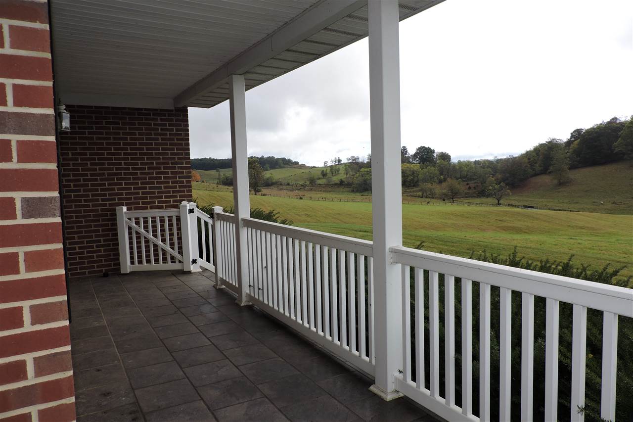 266 McKinley Road Middlebrook, VA 24459 - Photo 9 of 28 a view of a porch with a floor to ceiling window next to a yard