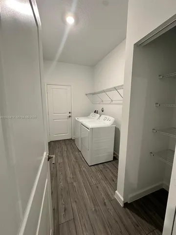 a view of a bathroom with wooden floor