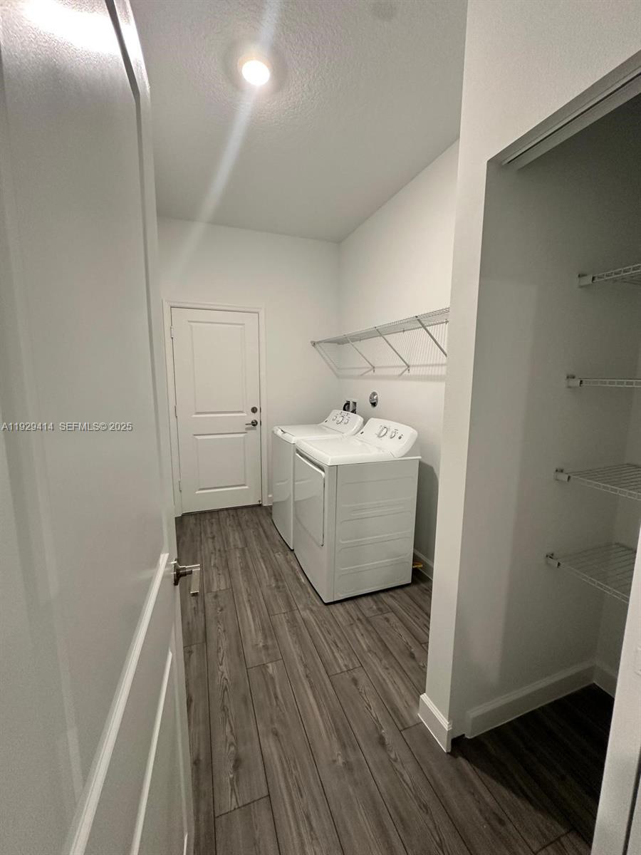 1443 Tangled Orchard Trace, Unit 1443 Loxahatchee, FL 33470 - Photo 18 of 33 a view of a bathroom with wooden floor
