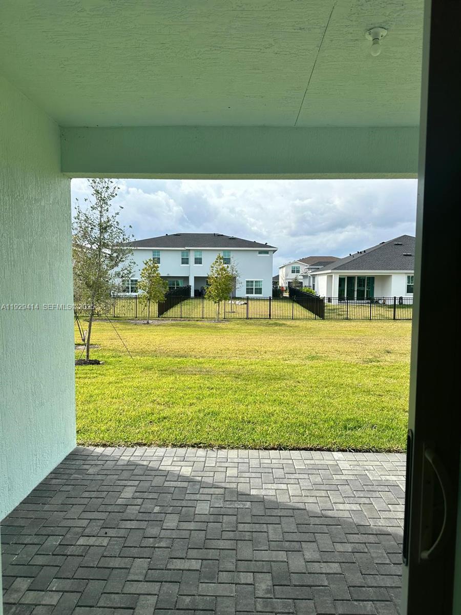 1443 Tangled Orchard Trace, Unit 1443 Loxahatchee, FL 33470 - Photo 32 of 33 a view of a swimming pool with an outdoor space