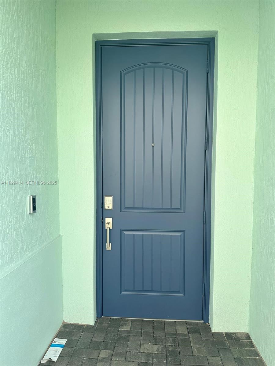 1443 Tangled Orchard Trace, Unit 1443 Loxahatchee, FL 33470 - Photo 4 of 33 a view of front door