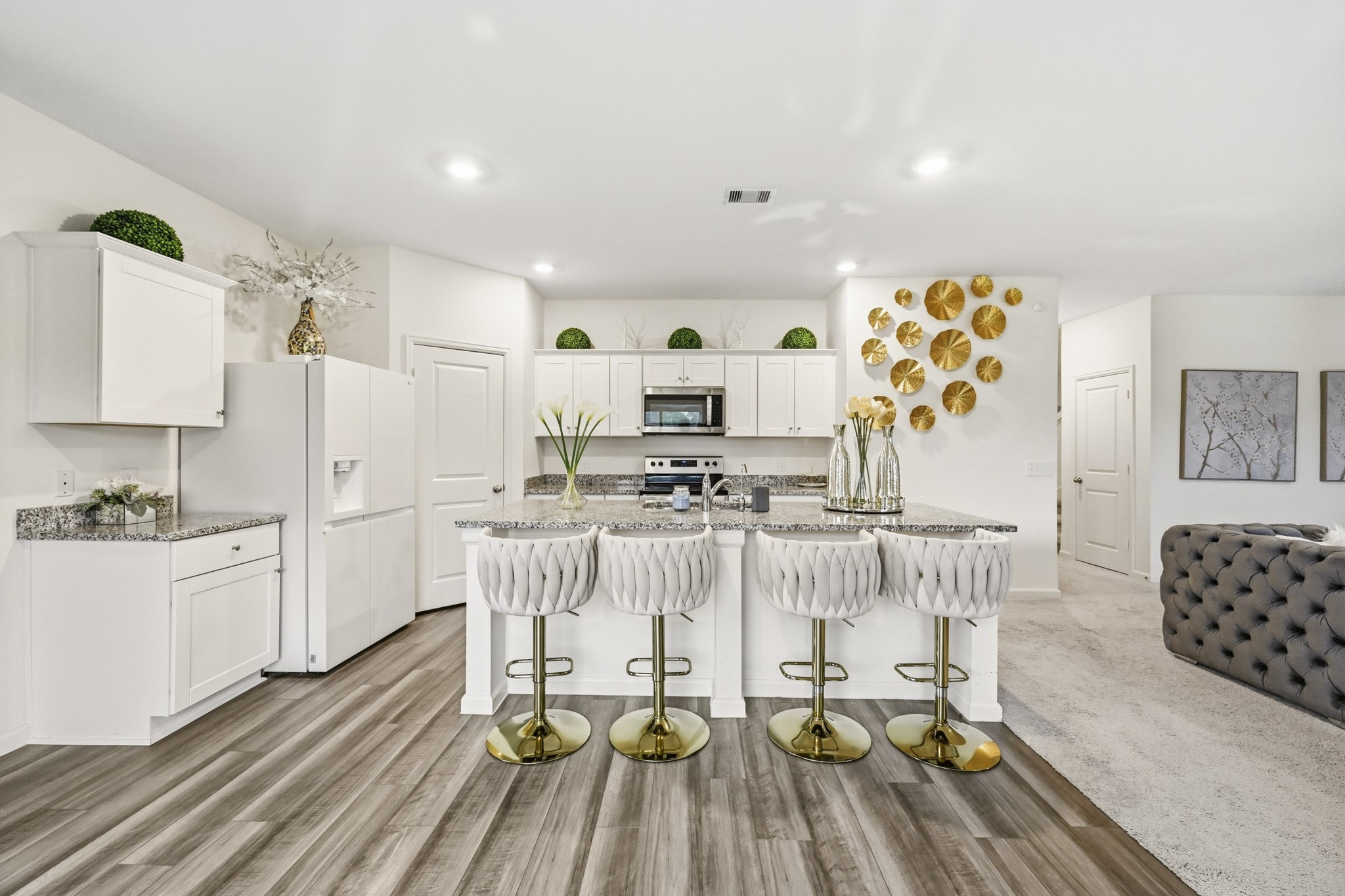 7207 Evitale Way Houston, TX 77049 - Photo 12 of 43 a living room with stainless steel appliances furniture and a kitchen view