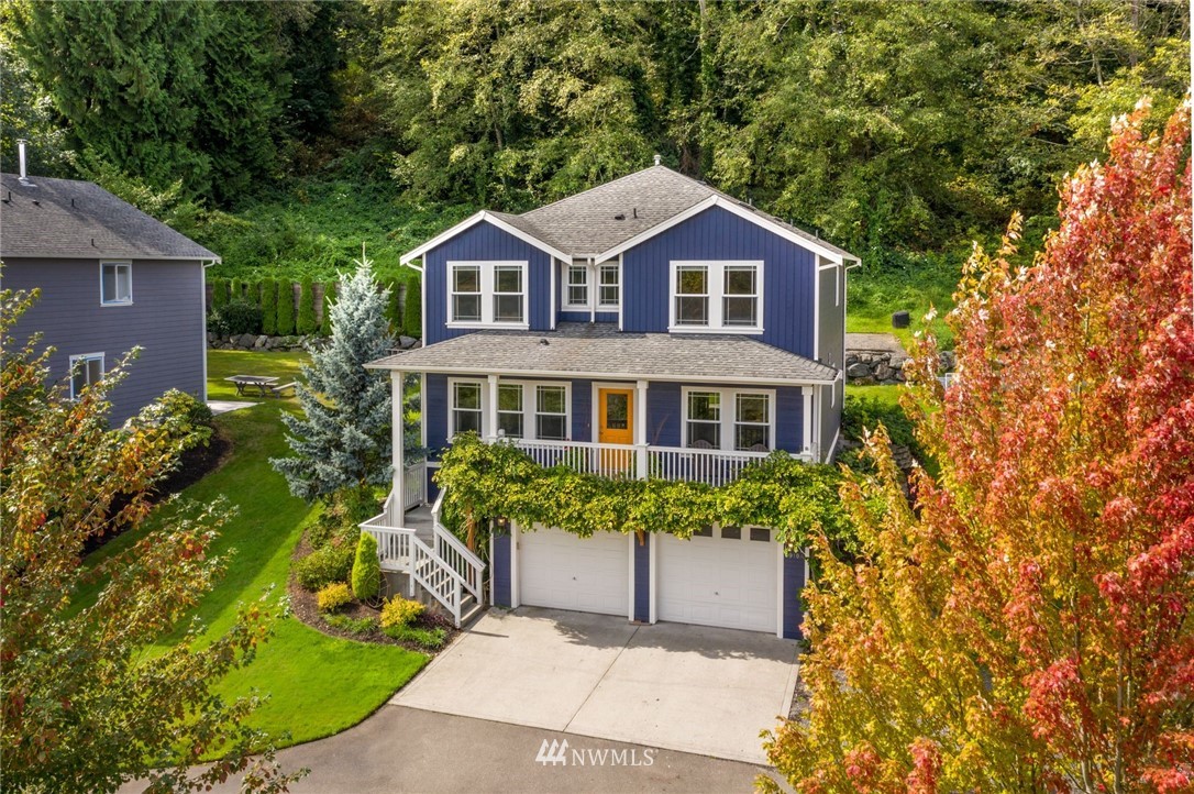 5910 Larimer Road, Unit A Everett, WA 98208 - Photo 1 of 24 a front view of a house with a yard and garden