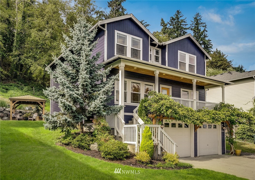 5910 Larimer Road, Unit A Everett, WA 98208 - Photo 5 of 24 a front view of a house with a garden and plants