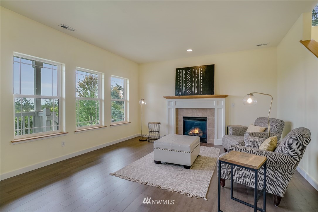 5910 Larimer Road, Unit A Everett, WA 98208 - Photo 7 of 24 a living room with furniture and a fireplace