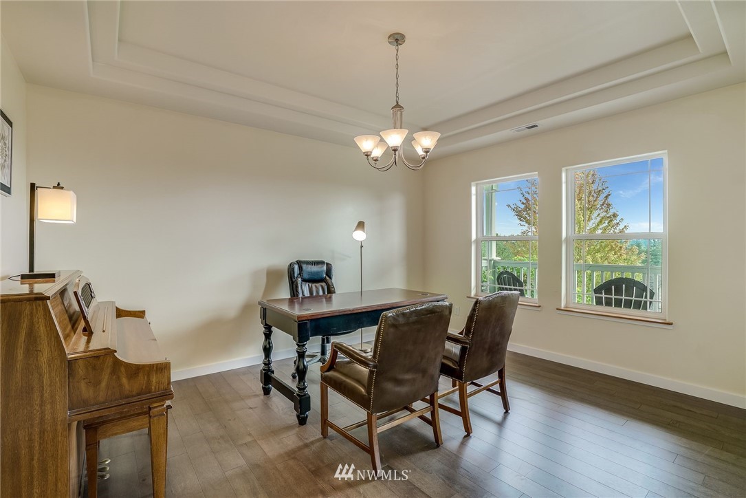 5910 Larimer Road, Unit A Everett, WA 98208 - Photo 9 of 24 a view of a dining room with furniture window and wooden floor