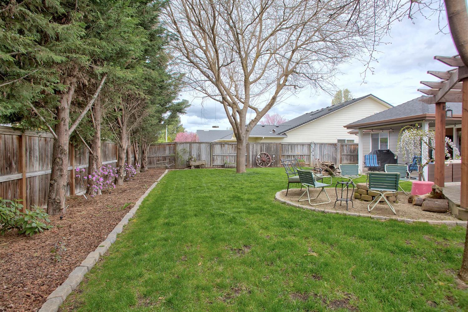 169 Orchardview Avenue Central Point, OR 97502 - Photo 26 of 28 a view of a house with backyard porch and sitting area