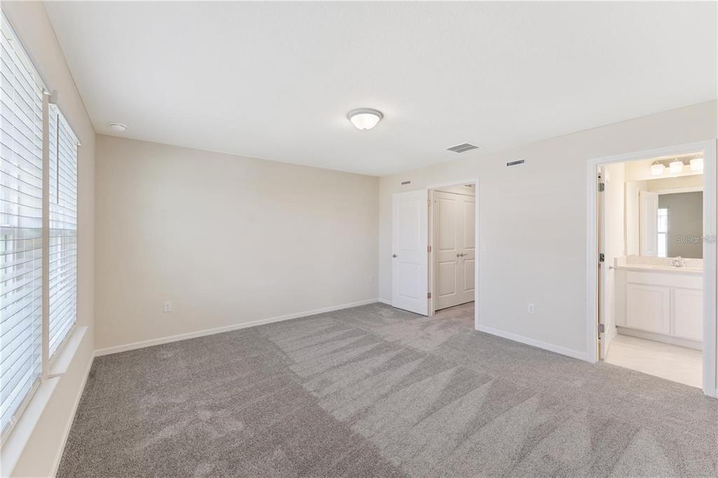 2326 Vision Street Davenport, FL 33896 - Photo 18 of 29 wooden floor in an empty room with a window