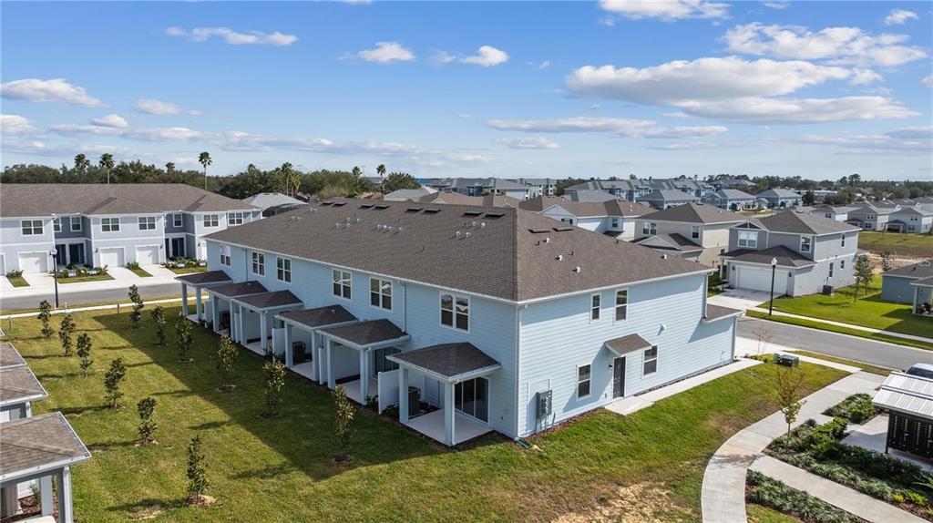2326 Vision Street Davenport, FL 33896 - Photo 28 of 29 a view of a city with lawn chairs and large tree