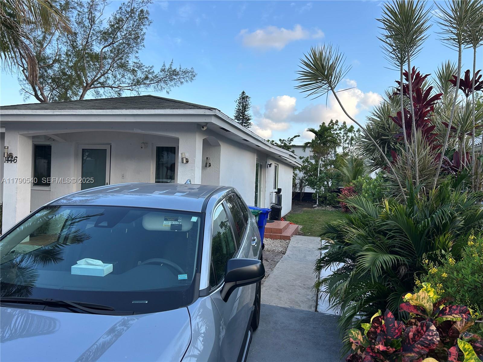 1446 Northwest 61st Street Miami, FL 33142 - Photo 2 of 54 a view of entryway with outdoor seating
