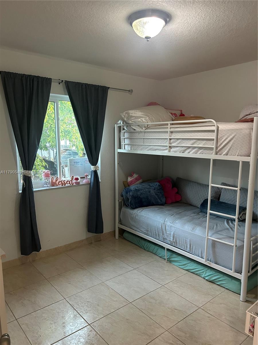 1446 Northwest 61st Street Miami, FL 33142 - Photo 24 of 54 a view of storage and utility room