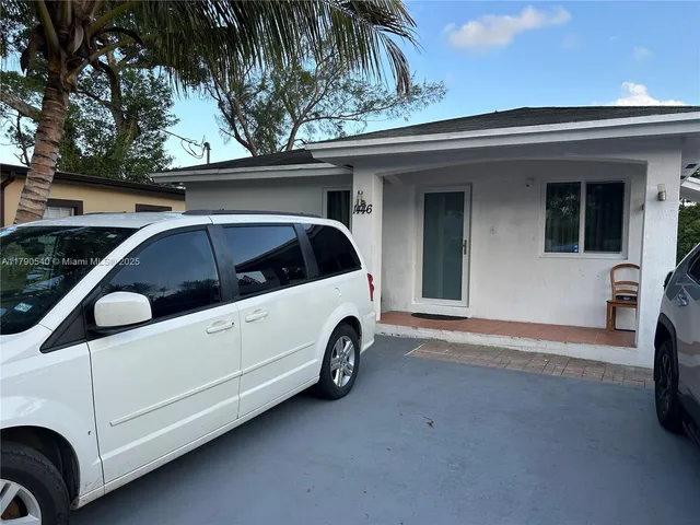 a view of a car in back of house