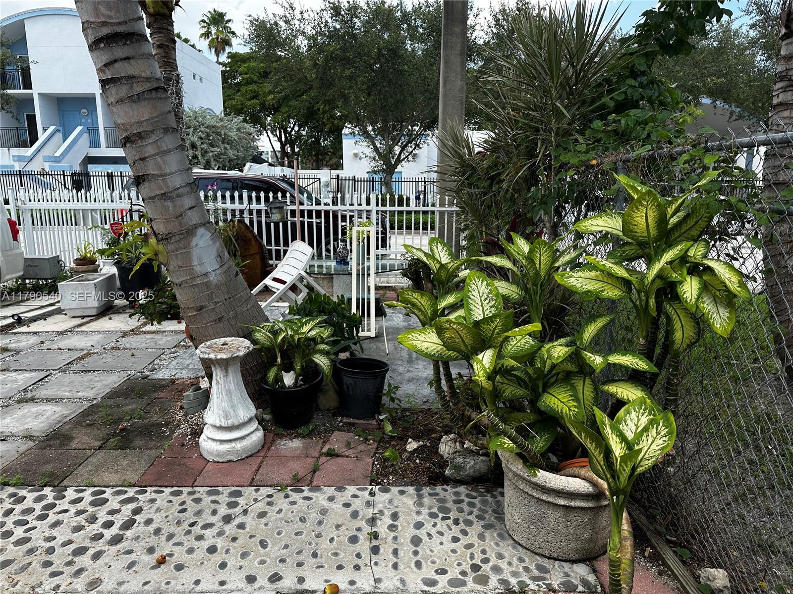 1446 Northwest 61st Street Miami, FL 33142 - Photo 33 of 54 a view of a balcony with potted plants