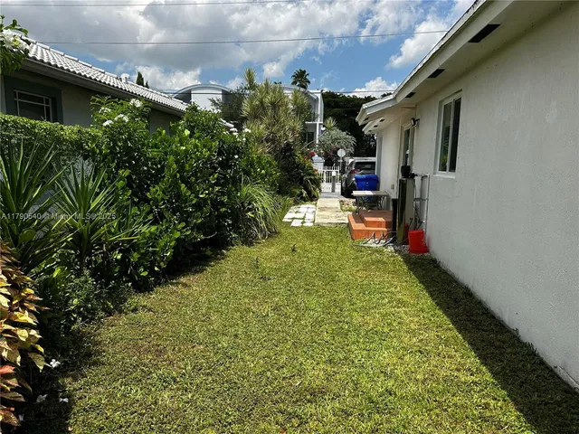 a view of a backyard with trees