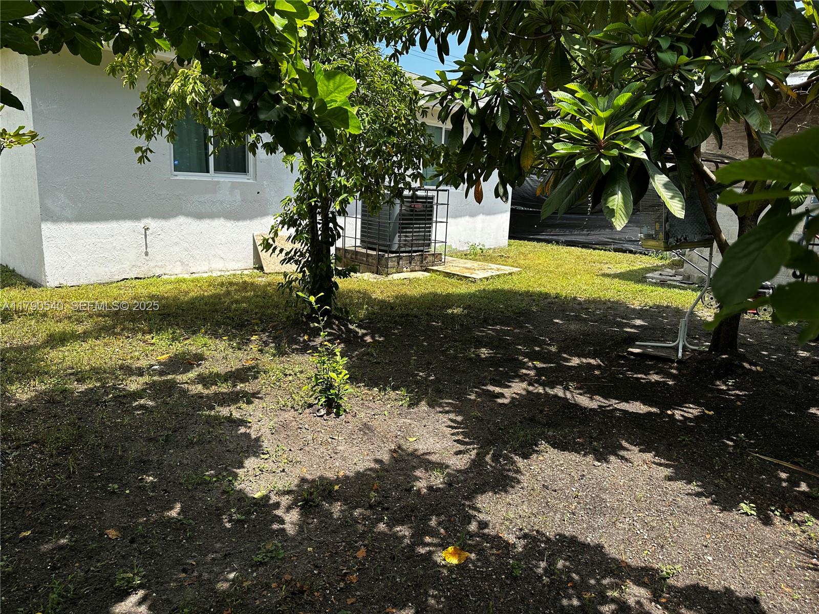 1446 Northwest 61st Street Miami, FL 33142 - Photo 35 of 54 a view of a tree with yard