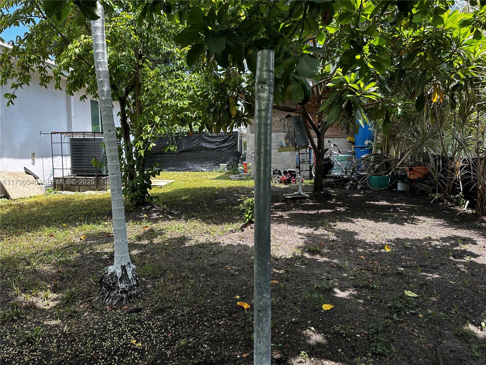 1446 Northwest 61st Street Miami, FL 33142 - Photo 36 of 54 a backyard of a house with lots of green space