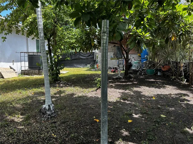 a kitchen with refrigerator and cabinets