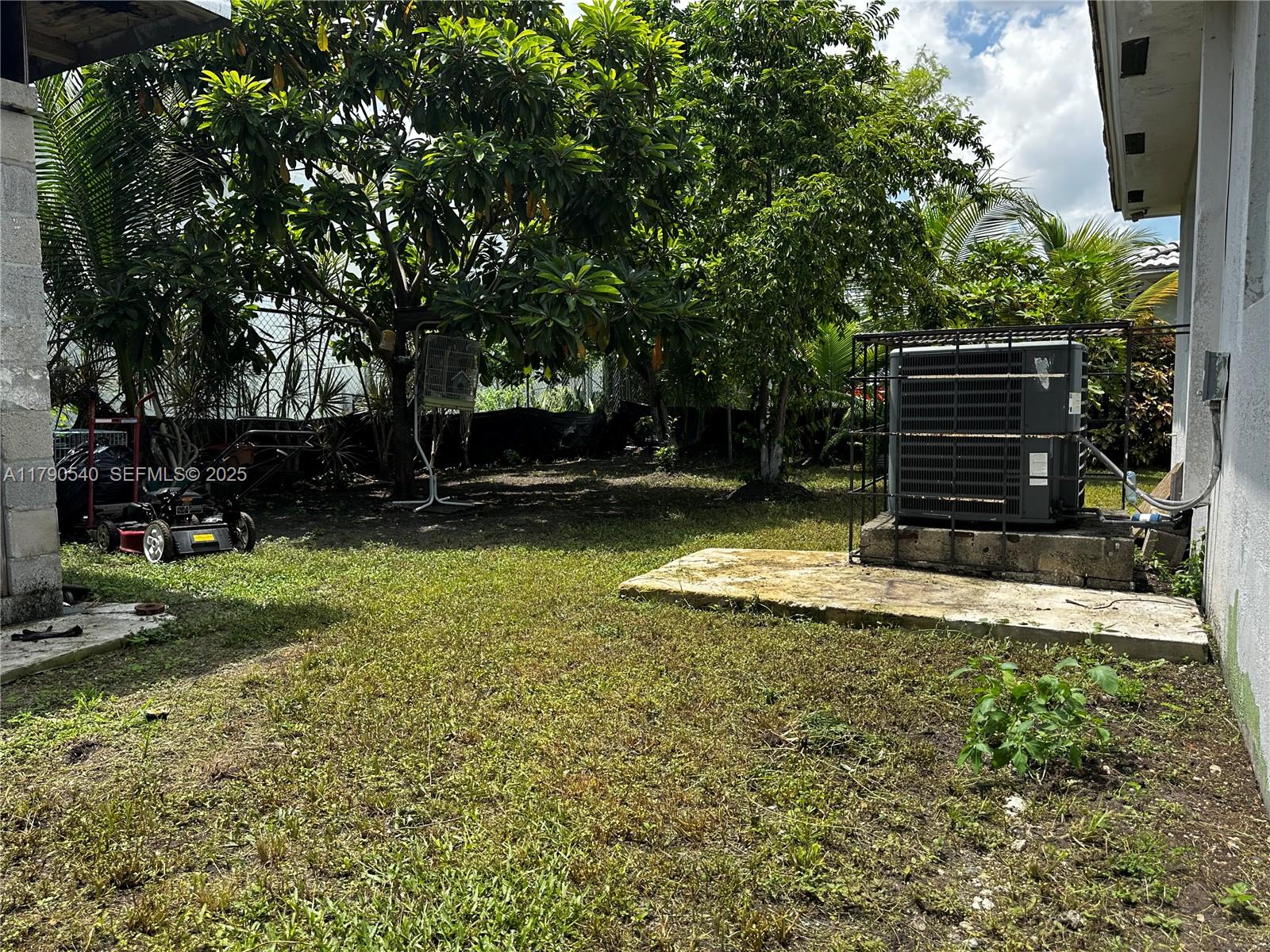 1446 Northwest 61st Street Miami, FL 33142 - Photo 38 of 54 a view of a backyard with trees
