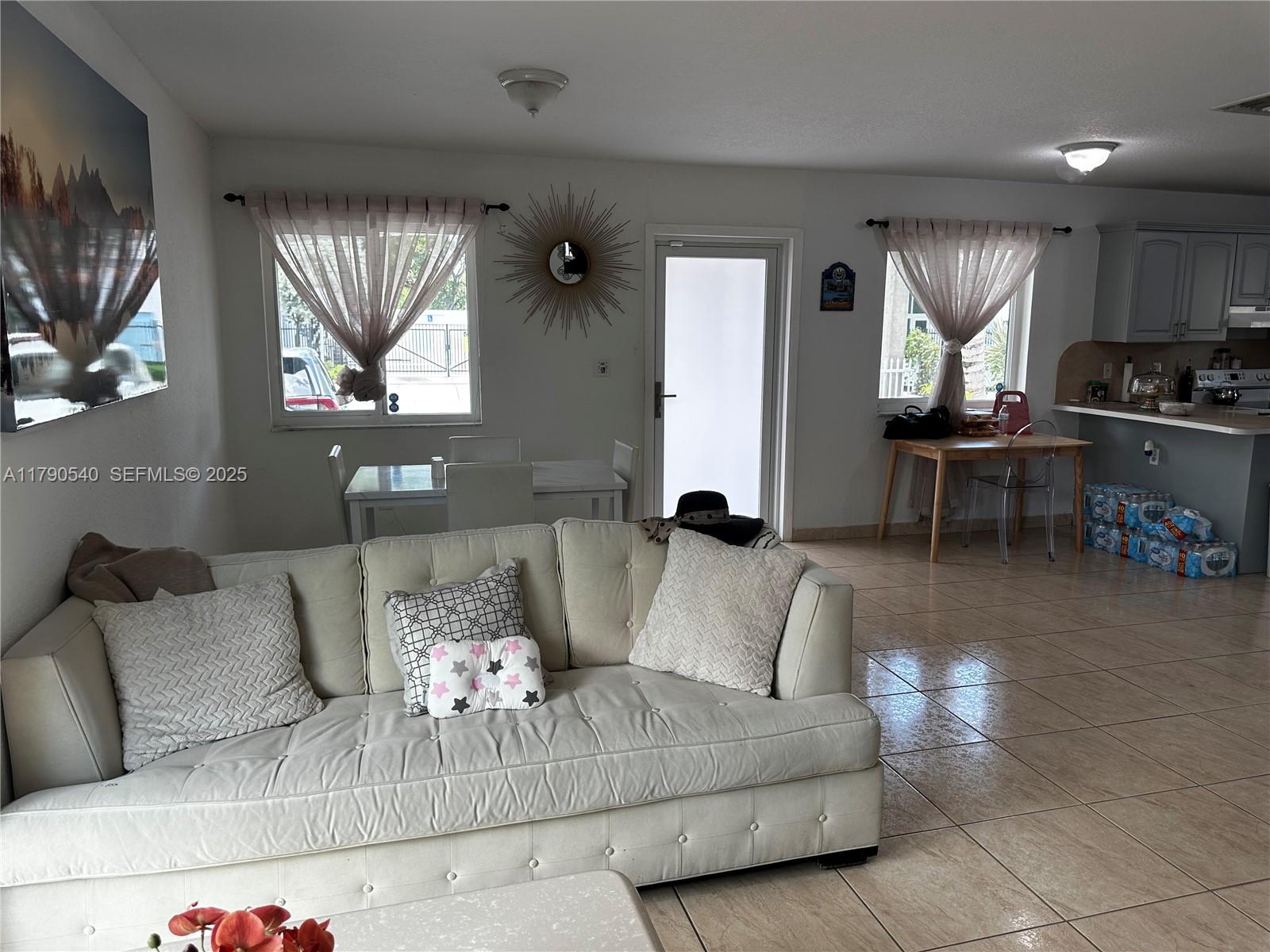 1446 Northwest 61st Street Miami, FL 33142 - Photo 41 of 54 a living room with furniture and a large window