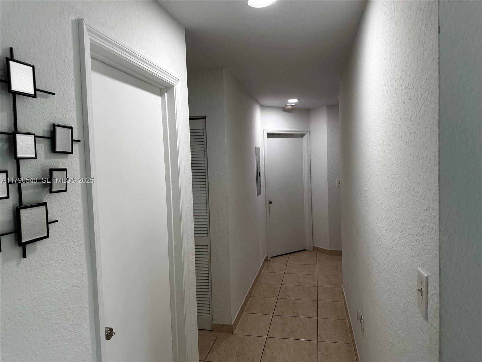 1446 Northwest 61st Street Miami, FL 33142 - Photo 44 of 54 a view of a hallway with wooden floor and closet