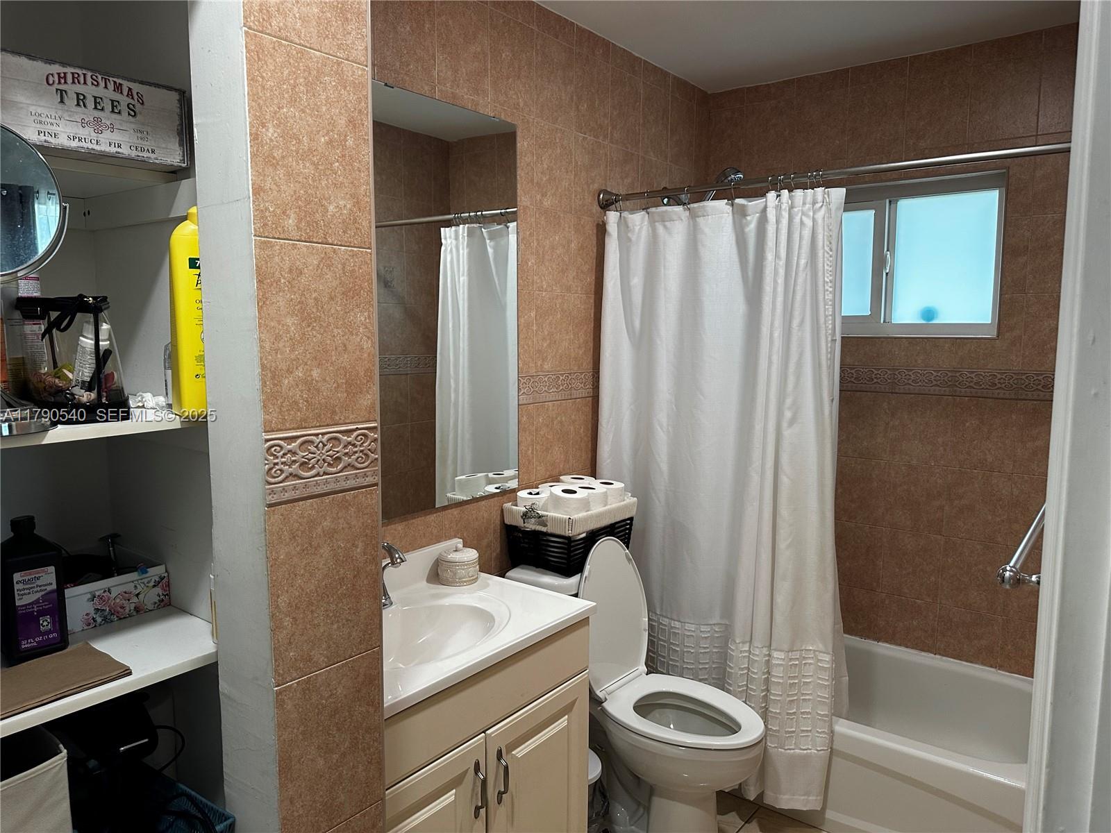 1446 Northwest 61st Street Miami, FL 33142 - Photo 50 of 54 a bathroom with a sink toilet and shower
