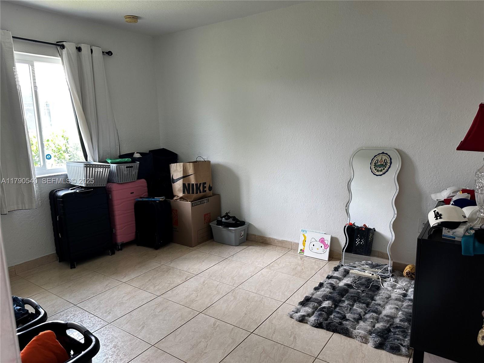 1446 Northwest 61st Street Miami, FL 33142 - Photo 52 of 54 a living room with furniture