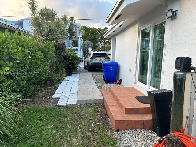a view of a dining room with furniture and window