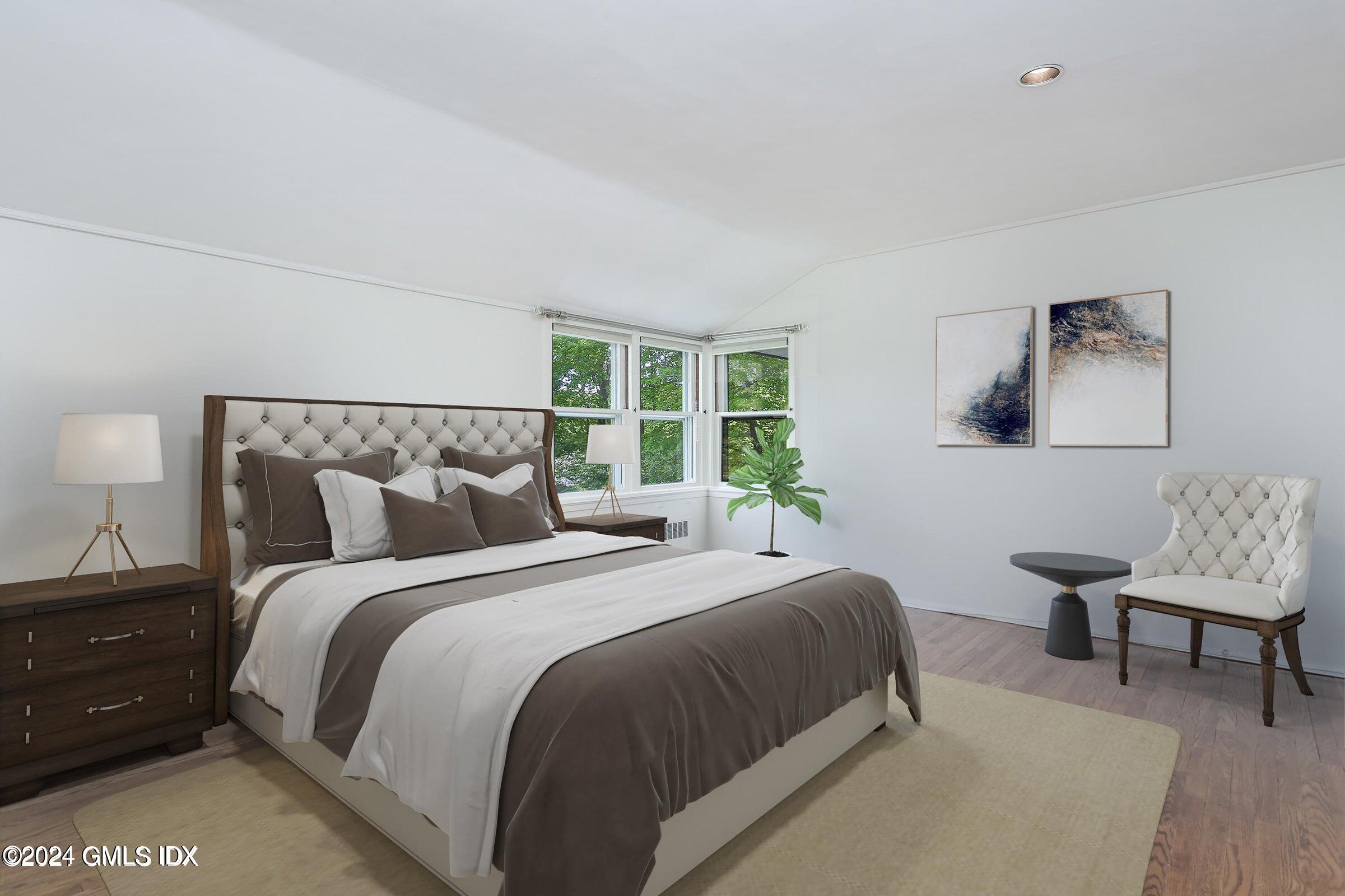 20 Martin Dale Greenwich, CT 06830 - Photo 11 of 25 a bedroom with a bed a chair and a potted plant on dresser