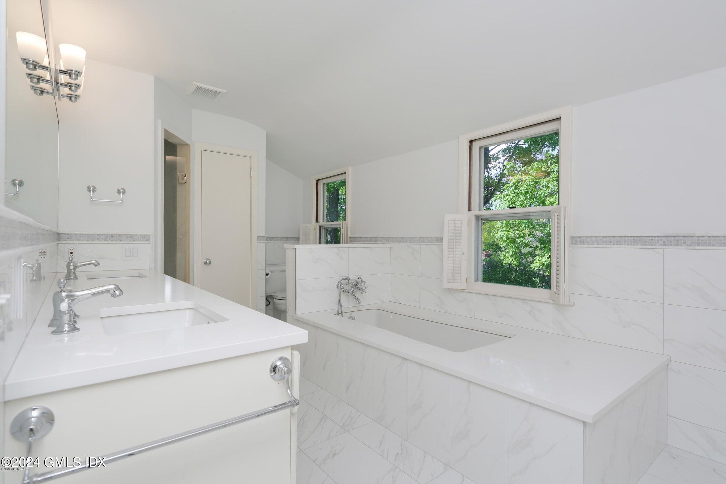 20 Martin Dale Greenwich, CT 06830 - Photo 12 of 25 a bathroom with a sink and a mirror