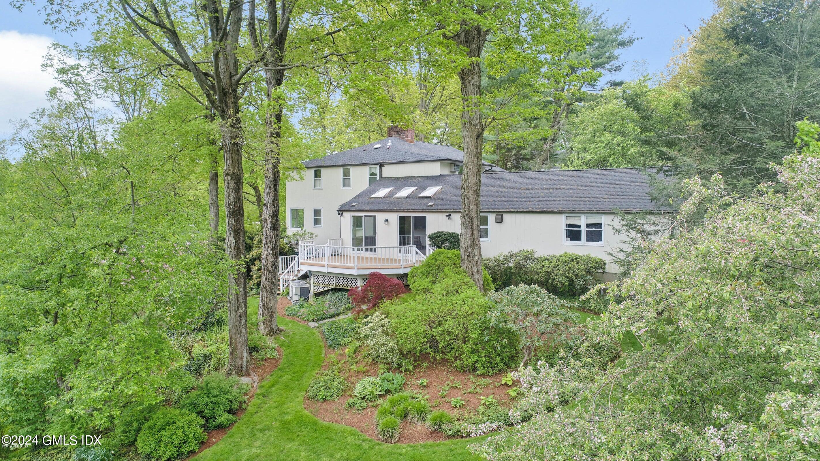 20 Martin Dale Greenwich, CT 06830 - Photo 20 of 25 a front view of a house with a garden