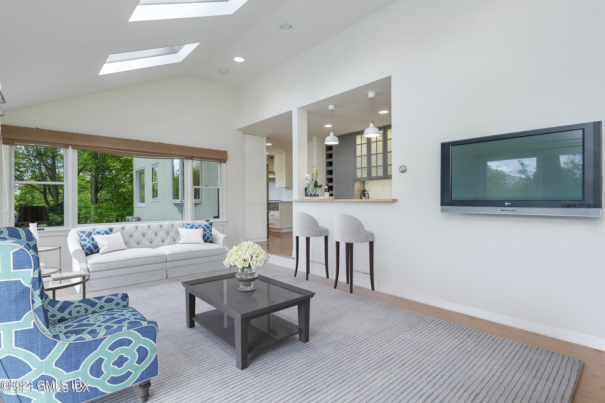 20 Martin Dale Greenwich, CT 06830 - Photo 5 of 25 a living room with furniture and a flat screen tv