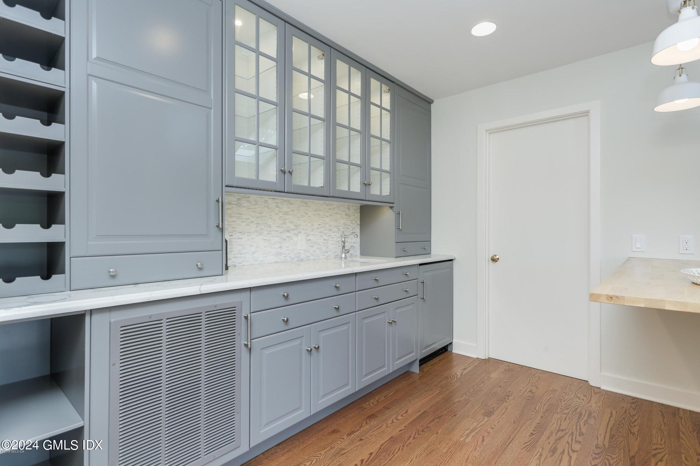 20 Martin Dale Greenwich, CT 06830 - Photo 8 of 25 a room with a white cabinets and wooden floor