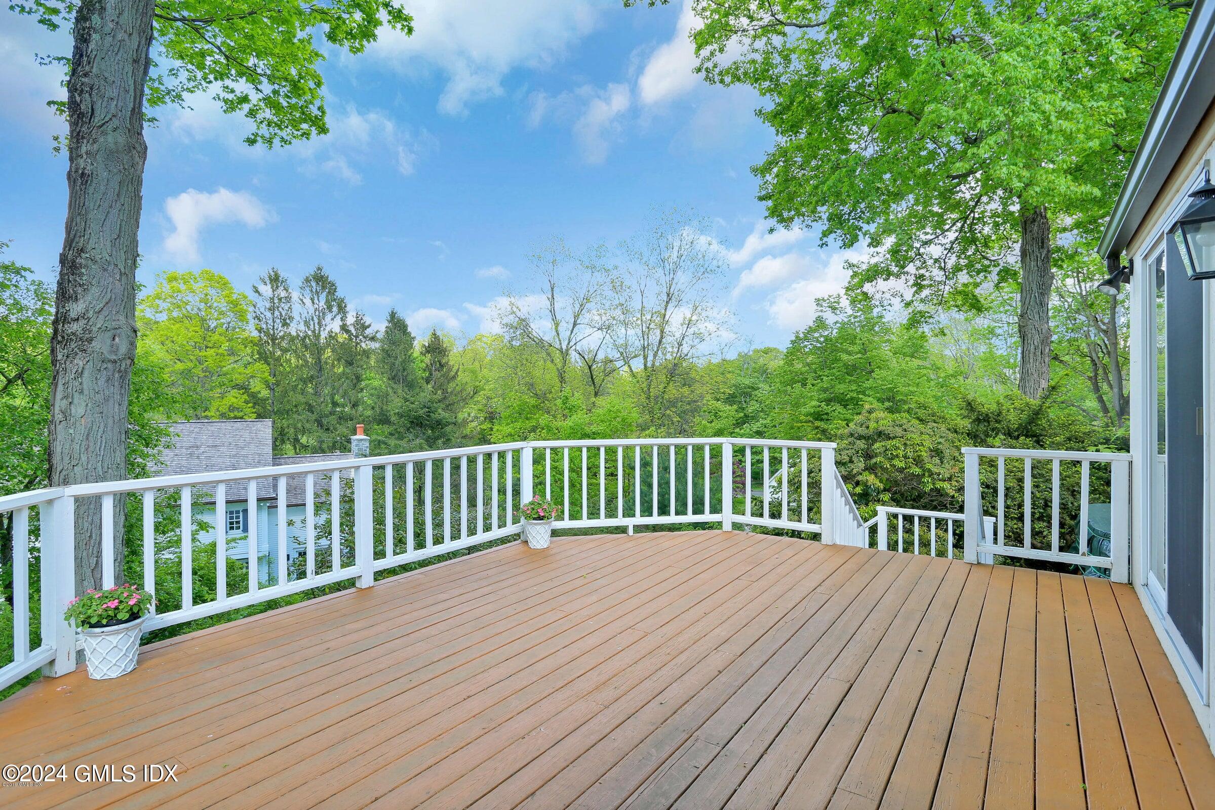 20 Martin Dale Greenwich, CT 06830 - Photo 10 of 25 a balcony with wooden floor and trees