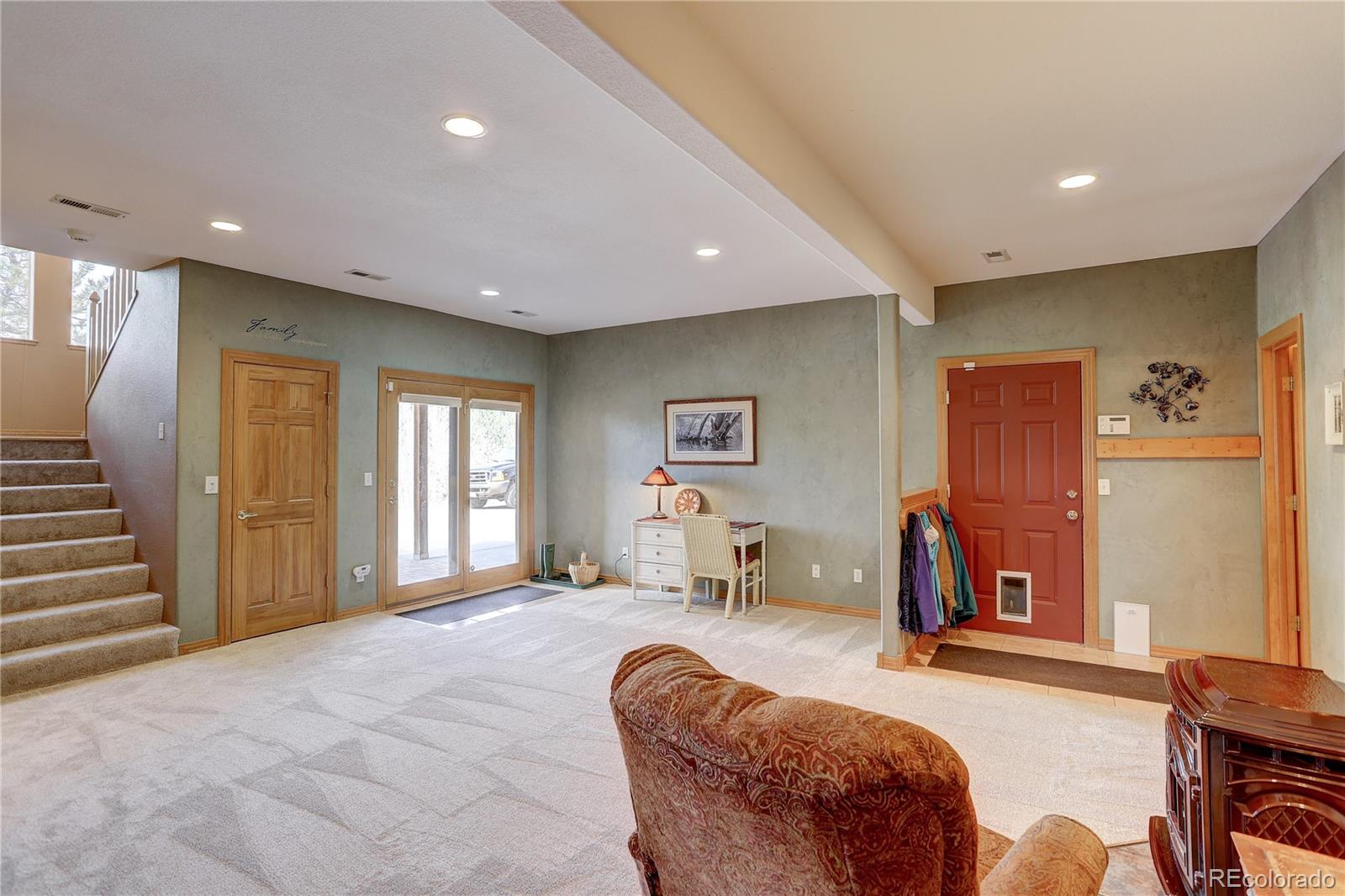 109 Royal Ridge Drive Bailey, CO 80421 - Photo 26 of 39 a spacious bedroom with a large bed and furniture