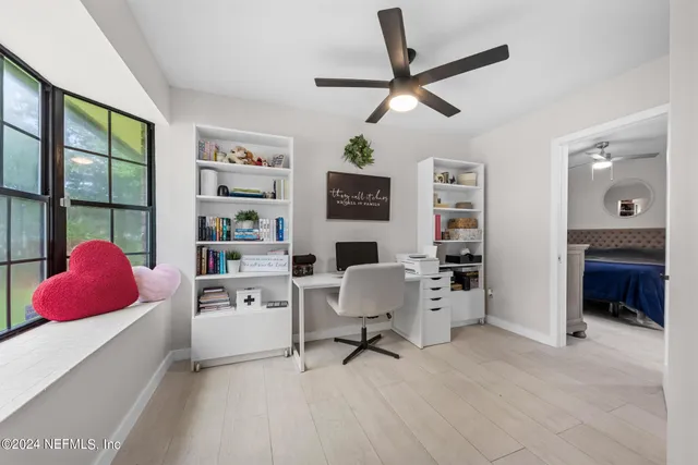 a bedroom with a bed and a chair