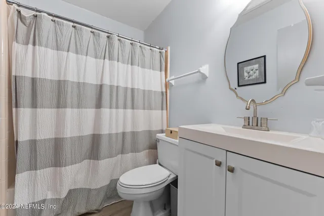 a view of a livingroom with furniture and a flat screen tv
