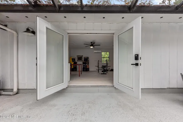 an aerial view of a house with a yard basket ball court and outdoor seating