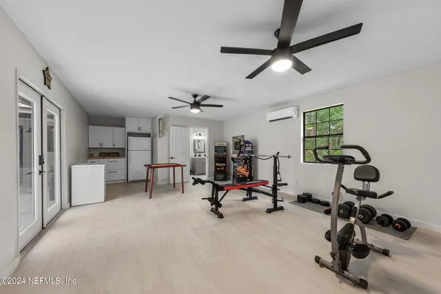 an aerial view of a house with a yard basket ball court and outdoor seating