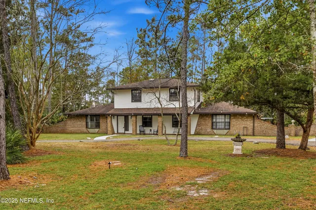 a view of a hallway with seating area
