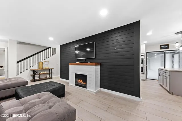 a kitchen with cabinets stainless steel appliances and a counter space