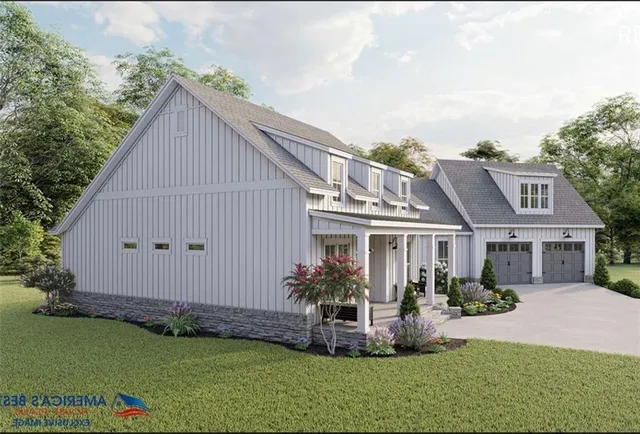 a front view of house with a garden