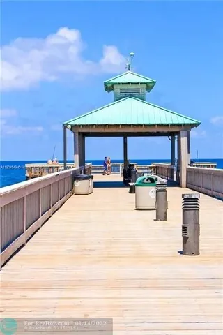 a swimming pool with a table and chairs