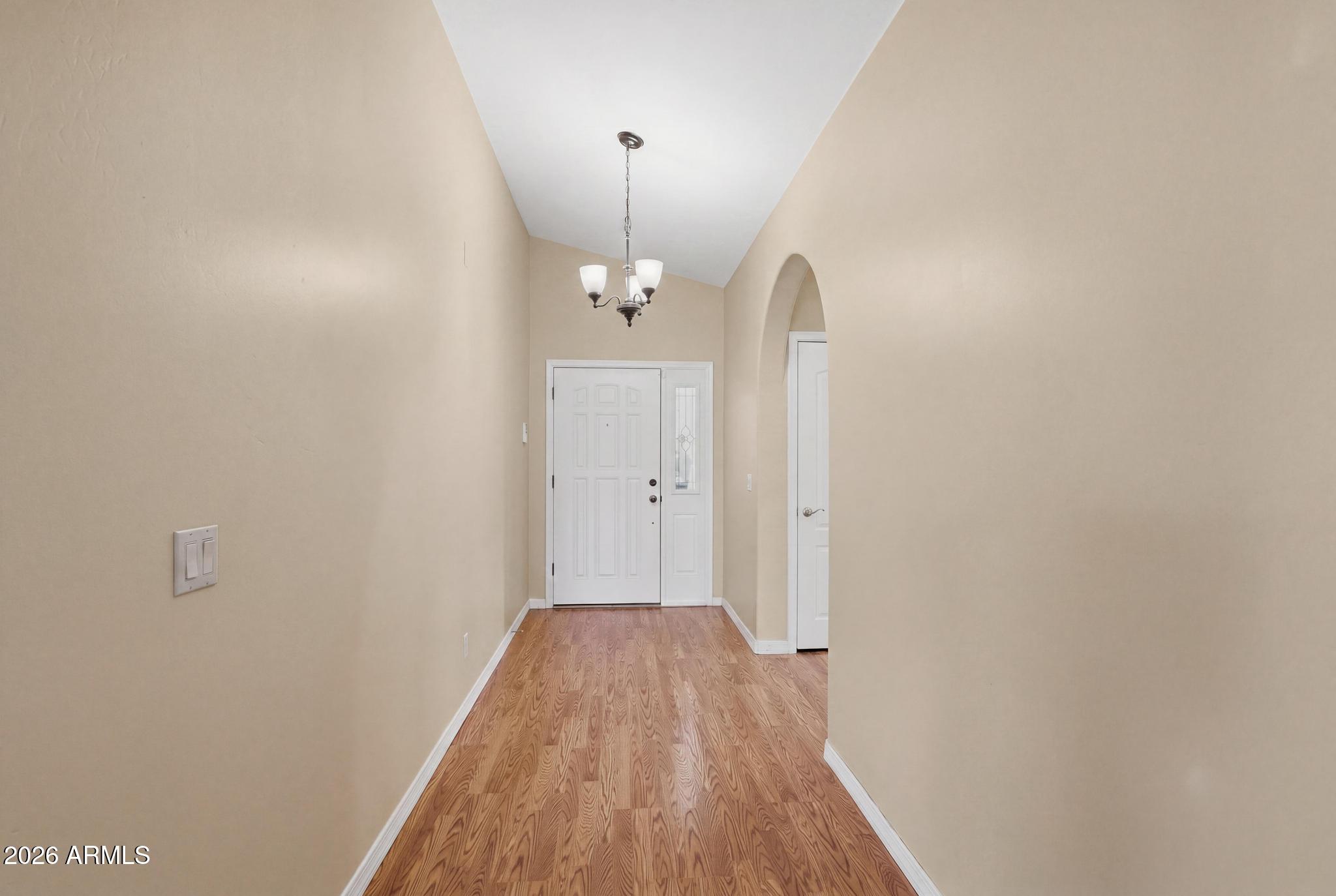408 East Phoenix Street Payson, AZ 85541 - Photo 14 of 35 a view of a hallway with wooden floor and chandelier