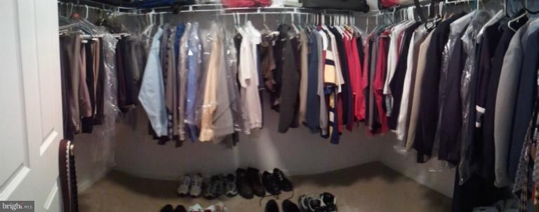 84 Boise Road Inwood, WV 25428 - Photo 14 of 30 a view of walk in closet with clothes and shoes