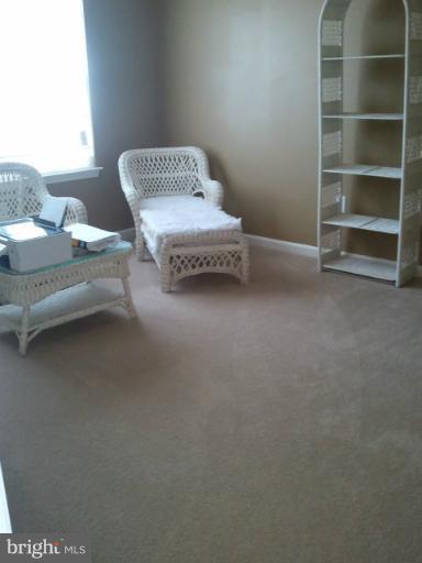 84 Boise Road Inwood, WV 25428 - Photo 3 of 30 a living room with furniture and a chair
