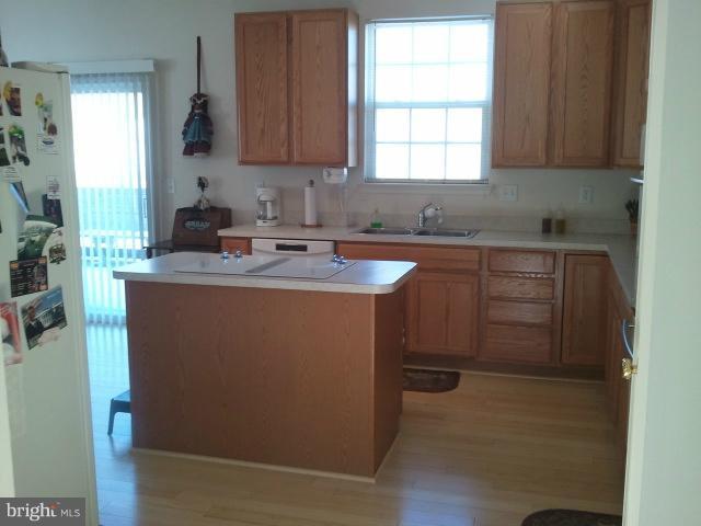 84 Boise Road Inwood, WV 25428 - Photo 6 of 30 a kitchen with appliances cabinets and a sink
